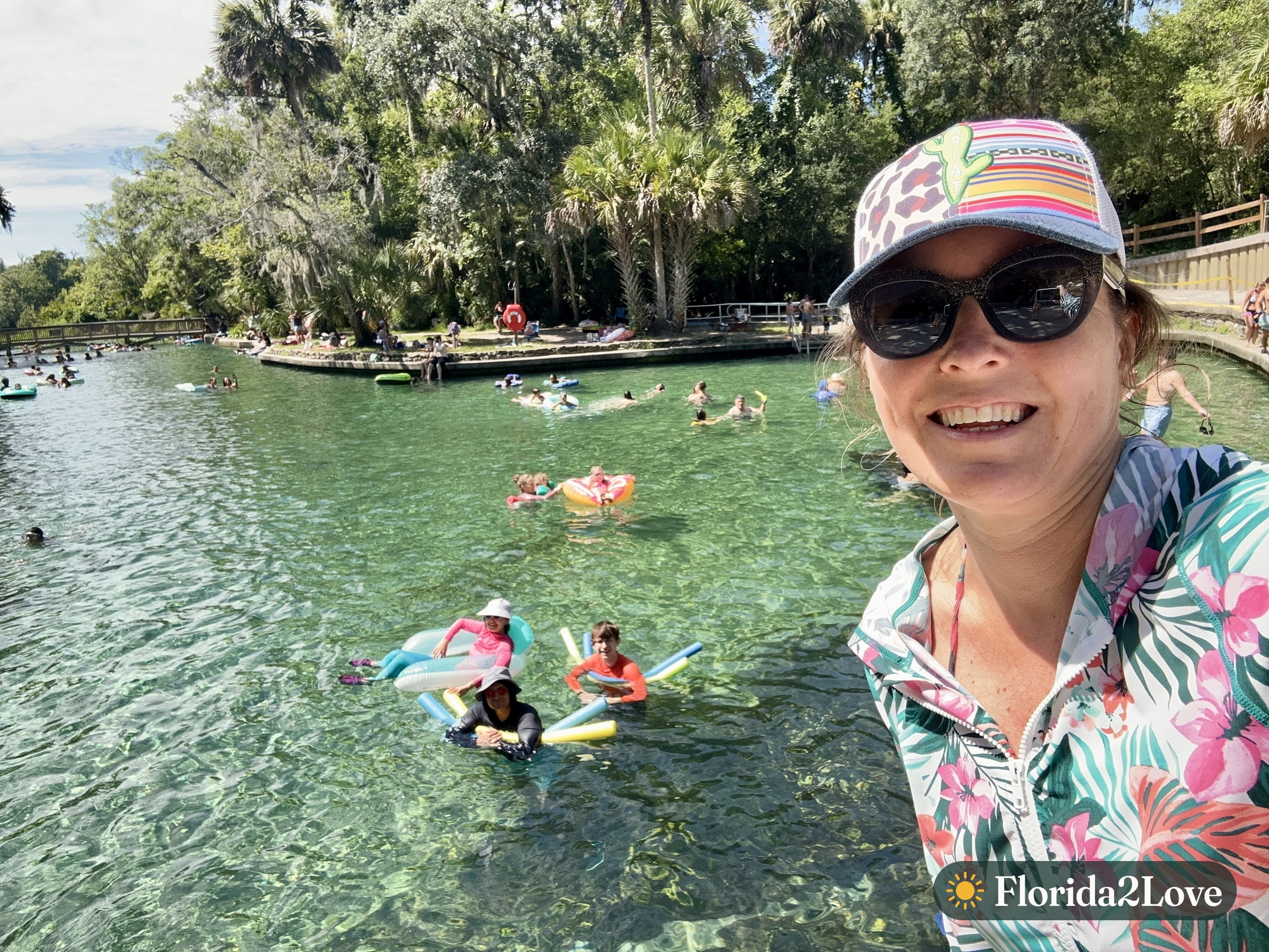A family floating and swimming in the clear water at Wekiwa Springs